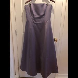 Bridesmaid dresses with matching shoulder wraps.